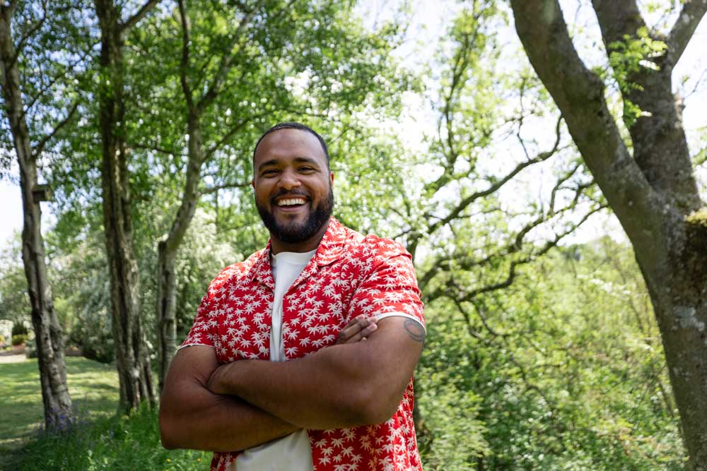 man outside in a woodland area