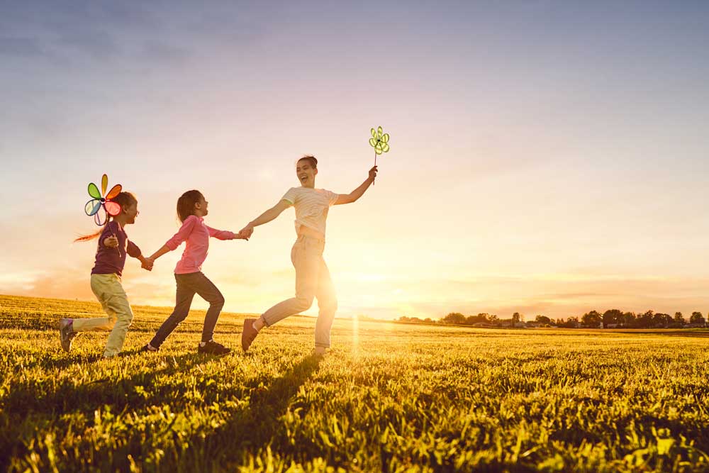 family is having fun on nature in the summer