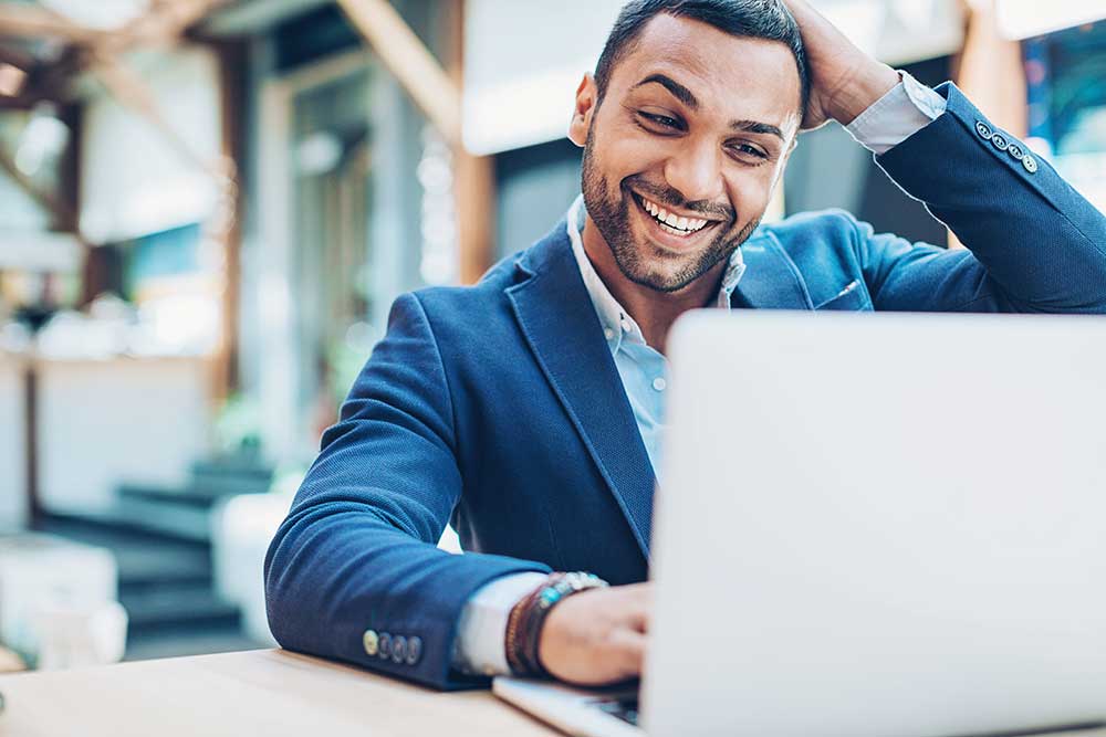 young businessman browsing on his laptop
