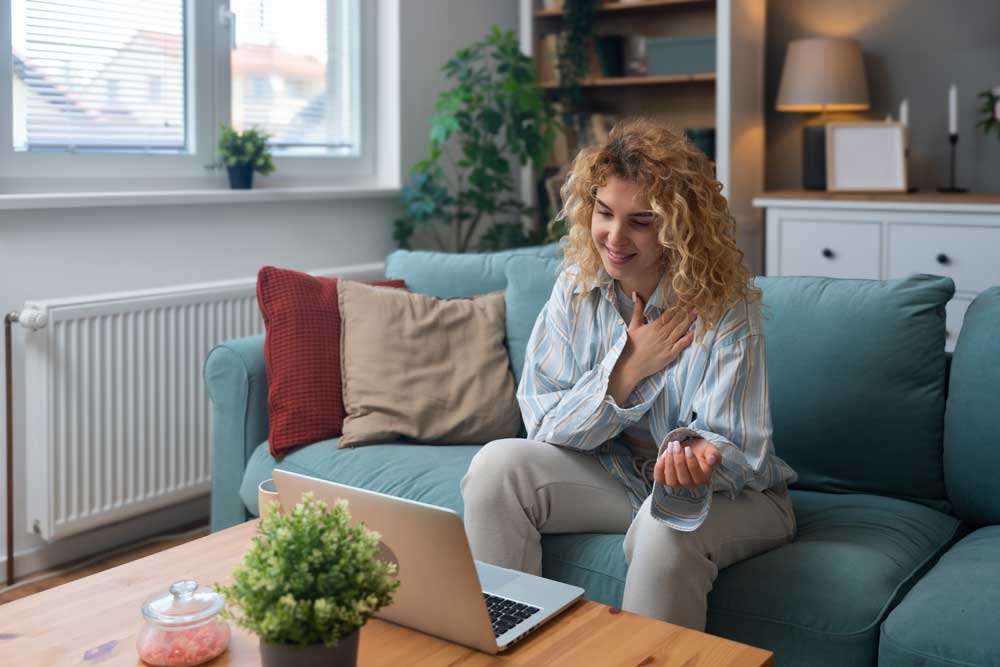woman on a video call with her doctor